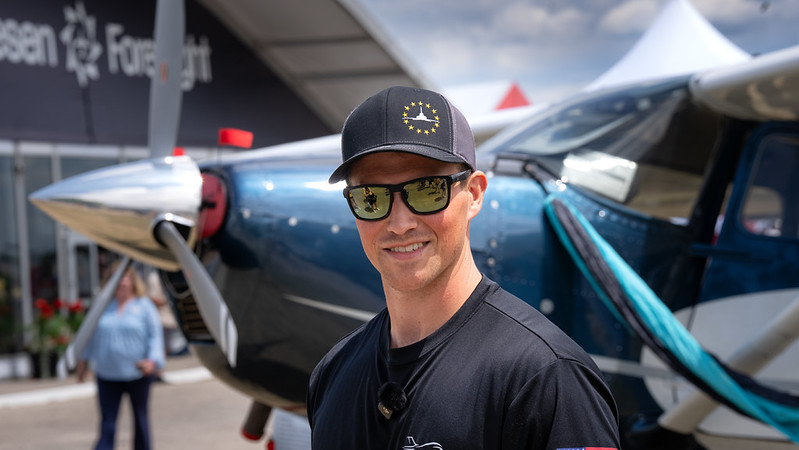 Photo: Nicholas Schlabach, a student in the Aviation Management program at UW-Oshkosh, was busy at EAA AirVenture in July, working for an aircraft detailing company and networking with aviation industry experts. (UW-Oshkosh)