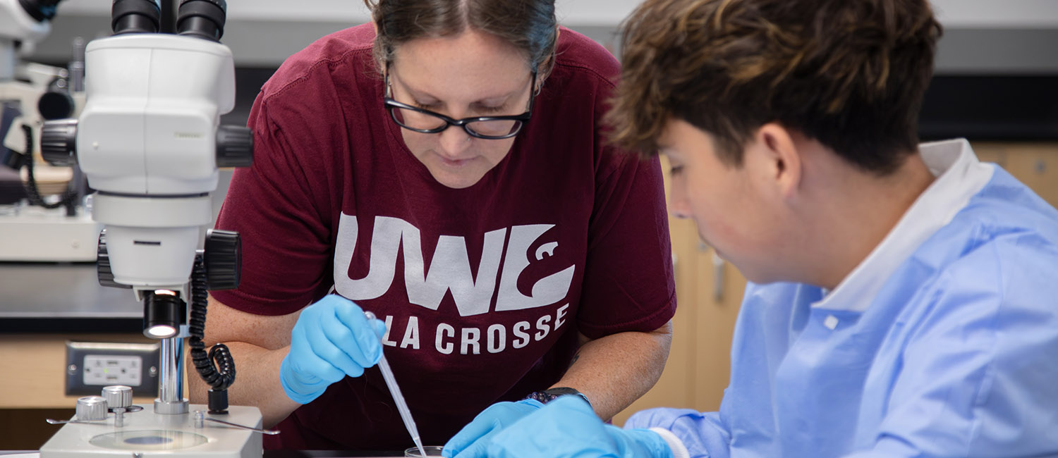 Photo: UW- La Crosse Professor Tisha King-Heiden assists a camp participant during zebrafish lab.