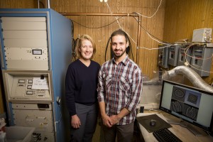 UWM Physicist Sarah Patch and undergraduate research assistant Yazeed Qadadha use a "souped-up" FM radio transmitter to generate high-frequency pulses that can be detected with ultrasound transducers. They're using the technology to build 3D images of prostates in hopes of detecting cancer. (UWM Photo/Derek Rickert)