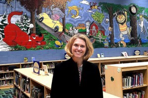 Tami Weiss painted a large mural at River Heights Elementary School to recognize the work of illustrators, the artists of children's books. The mural has also inspired children to read. See video at www.leadertelegram.com