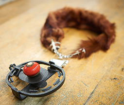 Brad Nichols, UWL associate professor of art, created this necklace — a mink with a live trap as the pendant. The piece was inspired by an artifact from the La Crosse County Historical Society collection.