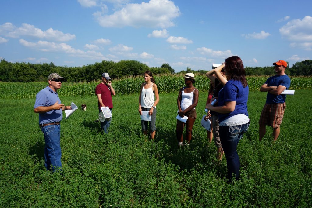 LAKES REU students at UW-Stout visit an area farm in 2014 as they conduct research on the social impact of poor water quality in the Red Cedar River watershed.