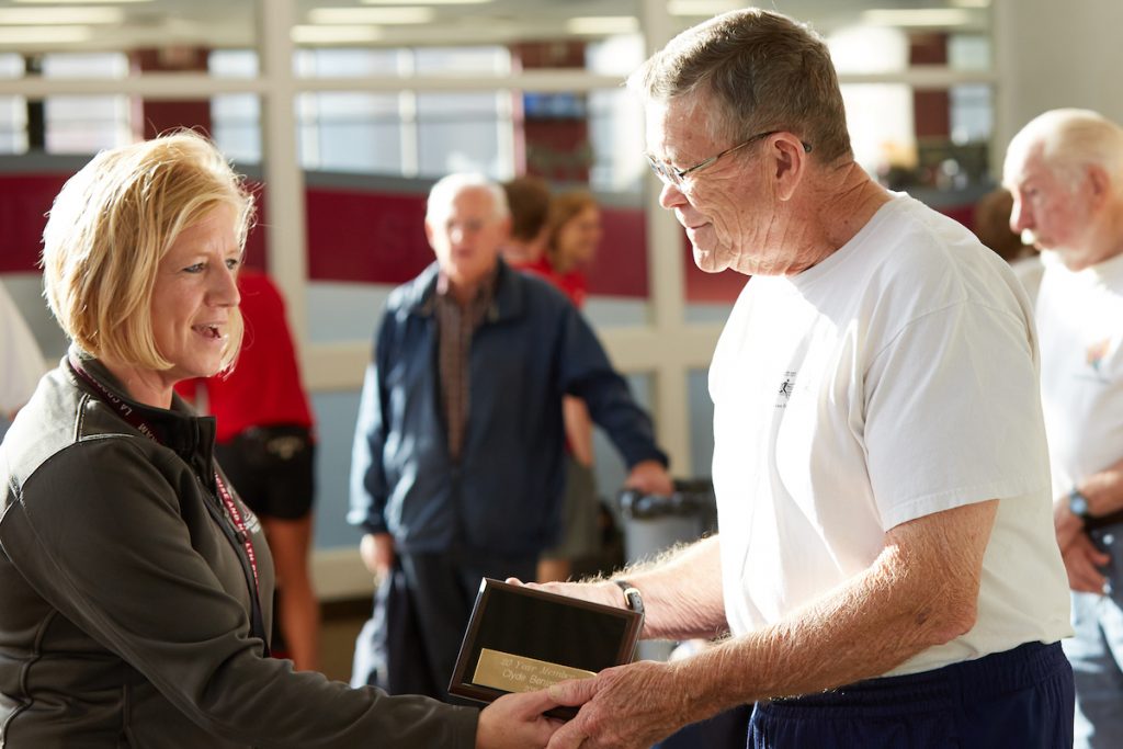 Program Director Kim Radtke, left, recognizes a long-term community participant in the program.