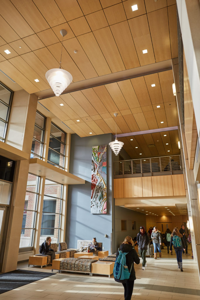 A combination of high efficiency lights and natural light have reduced energy consumption in Centennial Hall, UWL’s academic building. In this picture the wall mounted sconce lights and the numerous recessed ceiling lights in the two-story gathering area work with the natural light sensors and timers to allow a large area to be lit while consuming less energy. 