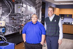 Hmong Vang (left) with his mentor Joe Russell at Watertech. Vang’s internship turned into a full-time job. (UWM Photo/Derek Rickert)