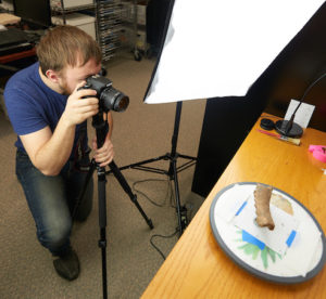 UWL Senior William Feltz says for each pottery fragment he took about 90 photos while turning the object on a rotating tray. The most difficult part of the project was developing a system to creatively prop up the 500-700-year old artifact without damaging it. 