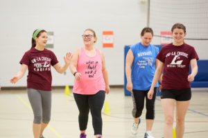 Summit Elementary School Special Education teacher Kasey Pomeroy, center, takes warm up laps with UWL Physical Therapy Students Brenna Dubick, left, and Abigail Bishop. The Physical Therapy students helped design a free and convenient fitness program at the La Crosse school to motivate more adult physical activity. 