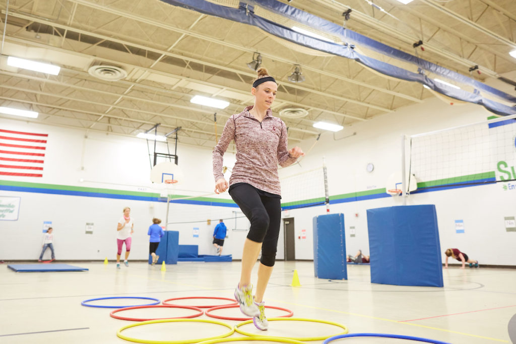 UWL graduate student Elizabeth Skaer helps lead a free fitness program for Summit Elementary School staff. The program is one of many community health and wellness programs led by UWL Physical Therapy students this semester. 