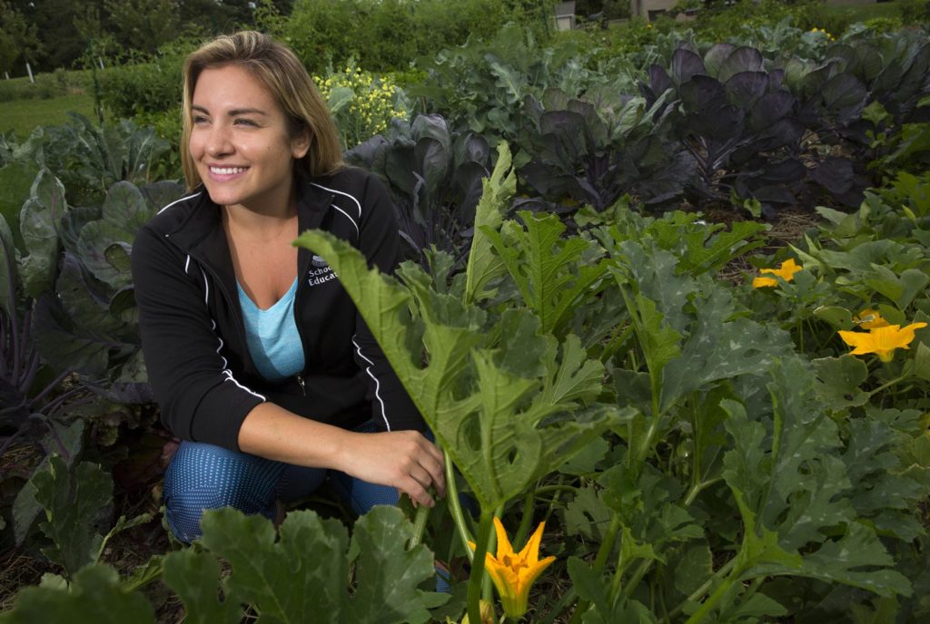 UW-Whitewater graduate student and classroom teacher in the Adams-Friendship School District, Heather Gayton on Friday, August 11, 2017, at the UW-Whitewater campus garden.