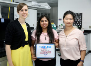 Photo of UW-Stout student Pratigya Thapaliya, center, receiving a WiSys innovation symposium certificate from Kristen Ruka, left, WiSys regional associate. At right is project director Assistant Professor Min DeGruson.