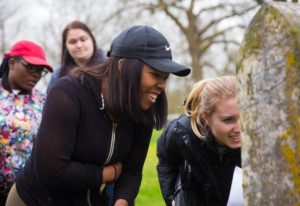 Photo of students visiting the grave of James D. Williams at Carmel Cemetery near Mineral Point, Wisconsin.