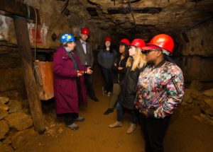 Photo of students touring the 1845 Lorenzo Bevans lead mine at Platteville's Mining and Rollo Jamison Museums.