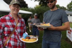 Photo of attendees with full breakfast plates, featuring many dairy products in honor of June as Dairy Month.