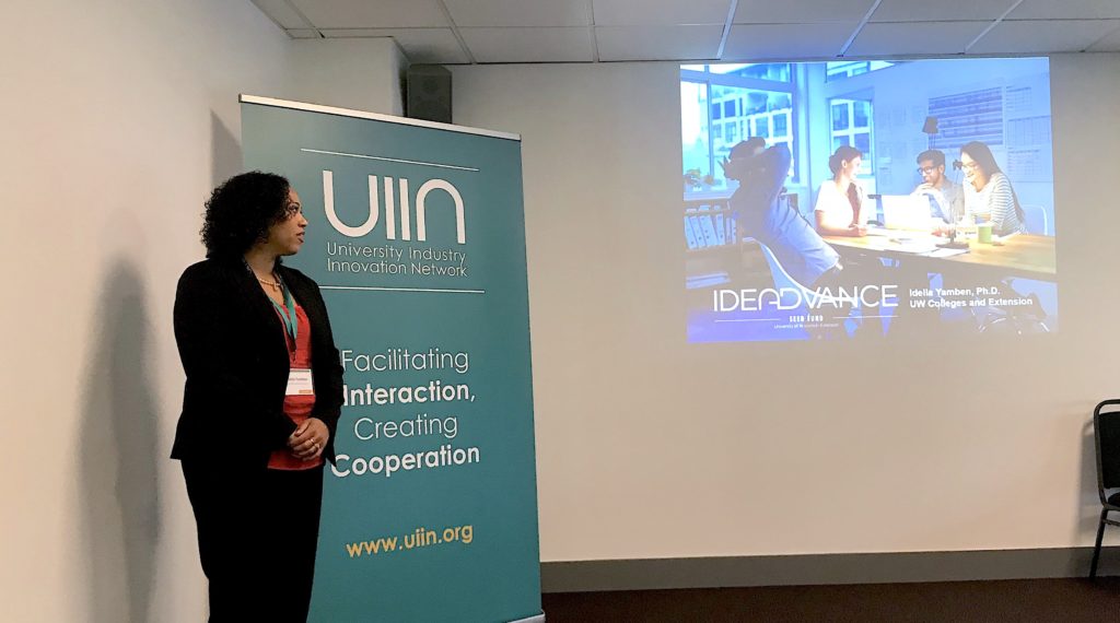 Photo of Idella Yamben, business development consultant for the Center for Technology Commercialization, discussing curriculum development and training for Ideadvance.