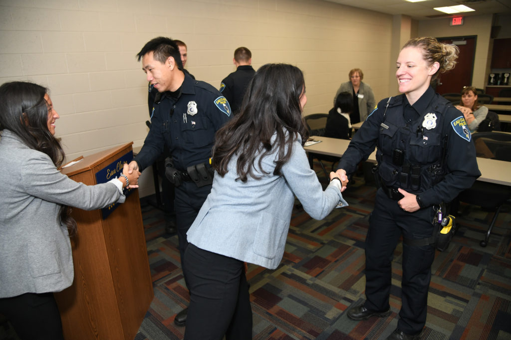 Photo of UW-Eau Claire researchers and Eau Claire police officers after research presentation