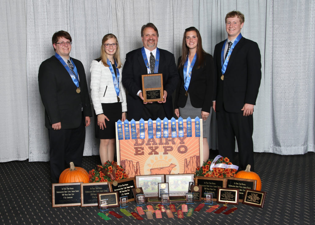 Photo of the UW-River Falls Dairy Judging Team, which captured top honors at the National Intercollegiate Dairy Judging Contest October 1, 2018, at the World Dairy Expo in Madison, Wisconsin. L-R: Matthew Kramer, Erica Helmer, Professor/coach Steve Kelm, Kaila Wussow Tauchen, and Clint Irrthum.