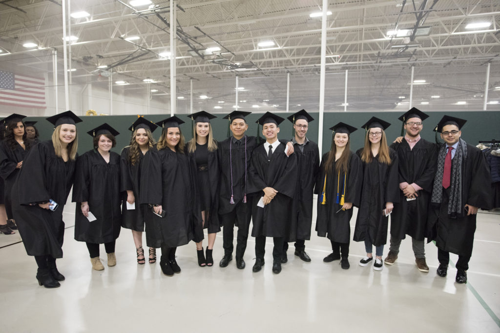 Photo of UW-Parkside graduates gathering for a photo op at the university's December 2018 midyear commencement ceremony.