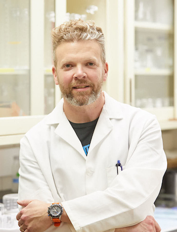 Photo of Nick Schloesser who came to UWL after a career in graphic design. His love of the outdoors attracted him to biology, which he pursued despite being convinced at a young age that he’d never be “a natural at math.” Schloesser struggled at times with college courses in math and science, but he didn’t give up and sought help from faculty. “I feel like I don’t have to be gifted at something to be good at it — I just have to put forth the effort,” he says.