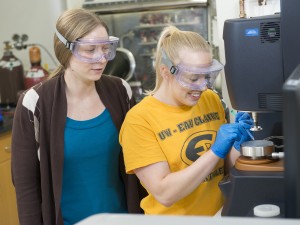 students measure viscosity of polymer samples