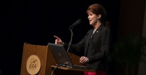 woman speaking at a podium