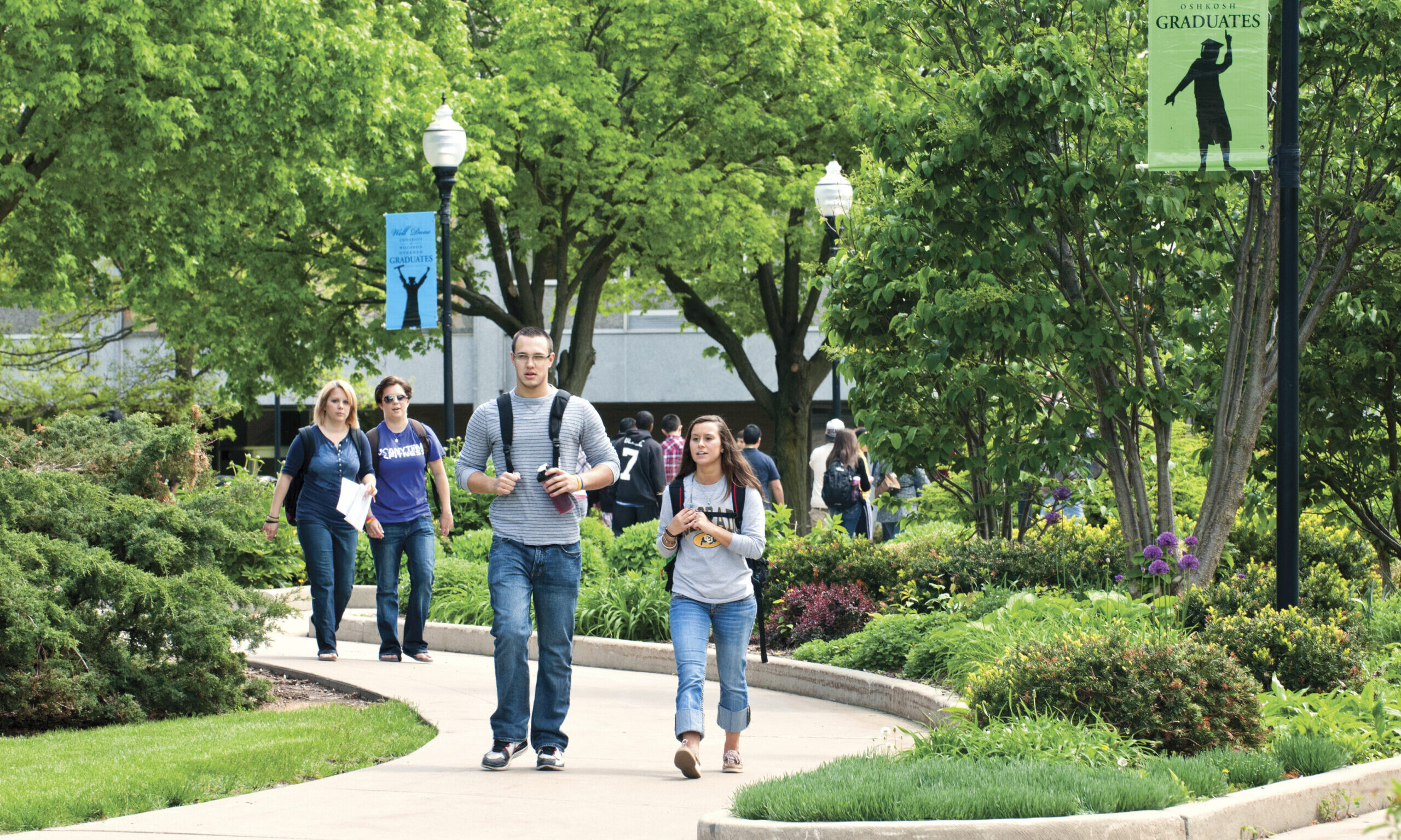 Students walking on campus in the springtime
