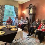 Universities of Wisconsin participants conversing at the May 1, 2025, Shared Governance Council reception at Brittingham House in Madison, Wisconsin.