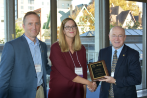 Dr. Amanda Tucker receives her award from President Cross