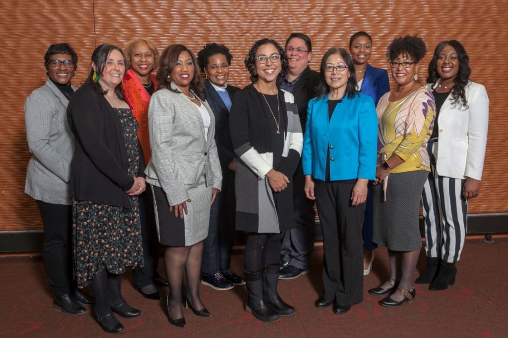 (from left to right) Sheronda Glass, UW-Parkside; Heather Ann Moody, UW-Eau Claire; Joan Prince, UW-Milwaukee; Veronica Warren, UW-Oshkosh; Catherine Nasara, UW-River Falls; Glendalí Rodriguez, UW-Stout; Katrina Werchouski, UW-Superior; Dong Isbister, UW-Platteville; Artanya Wesley, UW-Whitewater; Taviare Hawkins, UW-La Crosse; Courtney Taylor, UW-Stevens Point.
Not pictured: Cristina Ortiz, UW-Green Bay; Mariela Quesada Centeno, UW-Madison. (Photo by Brian Ebner, Optic Nerve LLC)