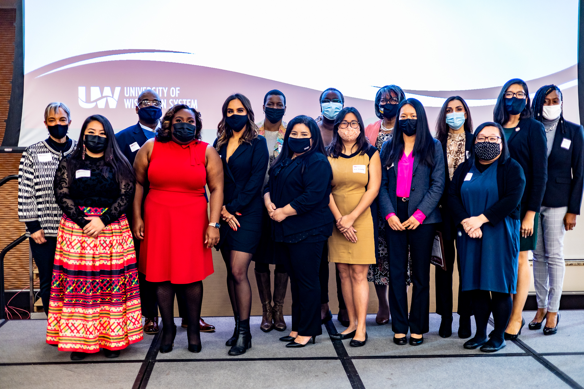 Photo of 2021 Outstanding Women of Color in Education Award recipients with UW System staff: (from left) Anny Morrobel-Sosa, UW System; Angela Yang, UW-Platteville; Warren Anderson, UW System; Jamila Lee-Johnson, UW System; Brittany Ochoa-Nordstrum, UW-Milwaukee; Renita Robinson, Prevea Health (selected by UW-Green Bay); Elisabeth Arguello, UW Oshkosh; Winnifred Bryant, UW-Eau Claire; Salisa Hochstetler, UW-Superior; Doris Johnson Browne, UW-Milwaukee; Wei Zheng, UW-Stout; Ana Caballero Mengibar, UW-Whitewater; Monica Yang, UW-La Crosse; Giovanna Gutierrez, UW-Parkside; Natasha Rayne, UW-River Falls. Not pictured: Sami Schalk, UW-Madison; Kaia Fitzgerald, UW-Stevens Point. (Photo by Hedi Rudd)