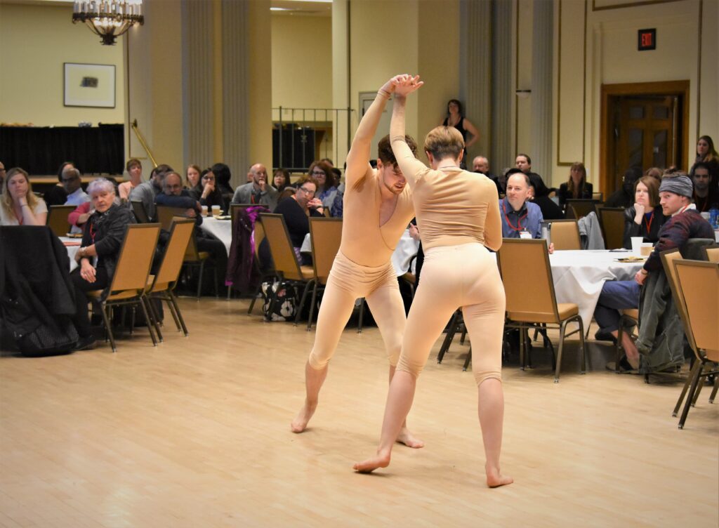 two dancers struggle