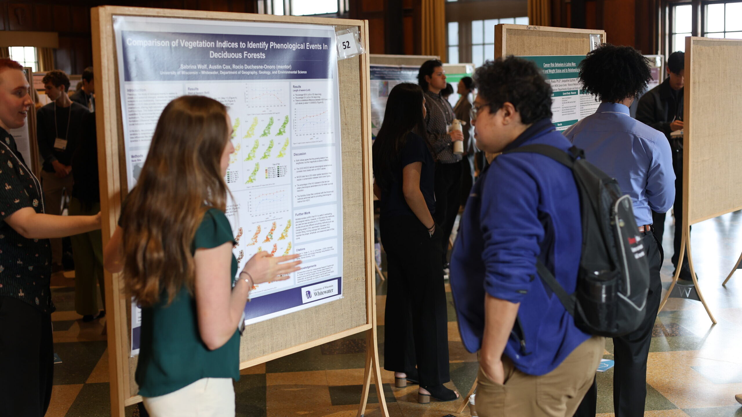 Students looking at a Comparison of Vegetation Indices to Identify Phenological Events in Deciduous Forests Poster