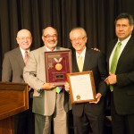 Regent Drew (second from right) shown with his resolution of appreciation; also pictured (from left): President Cross, Regent President Falbo, and Regent Manydeeds.