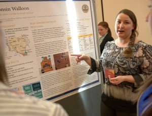 Senior economics major Kristina Hoyt co-presented the Walloon language research project poster at a 2015 event.