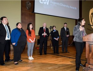 Members of UW-Stout's Multicultural Student Services acknowledge their group's receipt of a Regents' Diversity Award during the UW System Board of Regents meeting at Union South at the University of Wisconsin-Madison on Feb. 5, 2016. (Photo by Jeff Miller/UW-Madison)