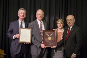 Regent Emeritus Charles Pruitt (second from right) is honored forhis years of service; also pictured (from left), Regent Bradley, Regent President Millner, and President Cross