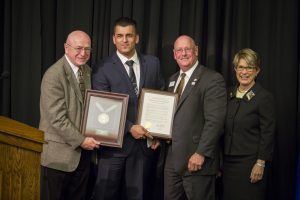 Regent Emeritus Harsy (second from left) is honored for his years of service; also pictured (from left): President Cross, Regent Higgins, and Regent President Millner