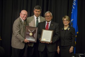 Regent Emeritus Vásquez (second from right) is honored for his years of service; also pictured (from left): President Cross, Regent Manydeeds, and Regent President Millner