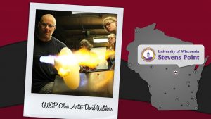 UWSP student Anna Lehner, Appleton, works with glass artist David Walthers at the university’s hot glass-working studio.