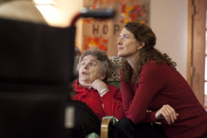 Anne Basting monitors UW-Milwaukee students as they present stories to senior citizens at Luther Manor in Wauwatosa, Wis., as part of the Penelope Project. (UWM Photo/Alan Magayne-Roshak)