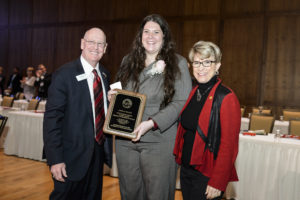 Angela Miller (center) with Regent Tim Higgins and Regent President Millner