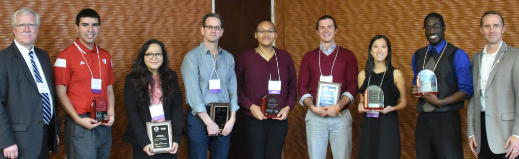 Photo of James Henderson, Vice President of Academic & Student Affairs, UW System; Kevin Hernandez; Prof. Kayoung Kim; Prof. Russ Castronovo; Ariana Saffold; Prof. Evan Larson; Ava Brueggeman; David Ababio; and Robert Durian, Chief Financial Officer of Alliant Energy