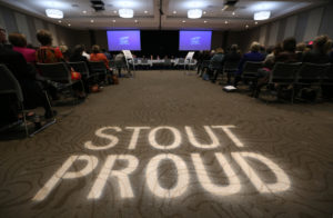 Photo of UW-Stout conference room that hosted the Board of Regents October 2017 meeting, with "Stout Proud" illuminated on the floor