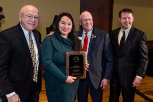 Bee Vang holds award