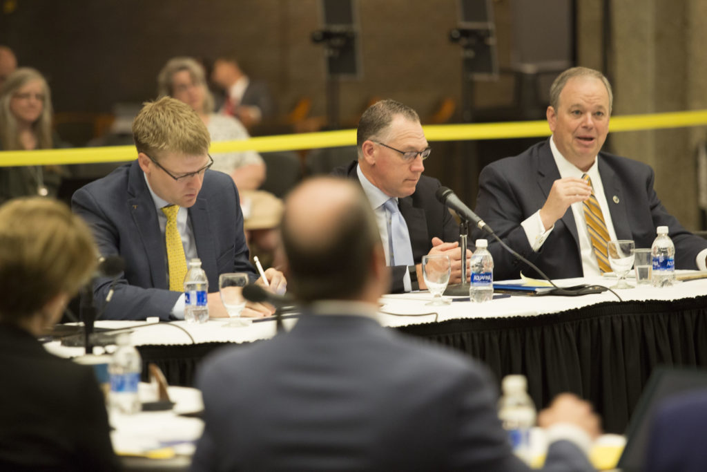 Photo of UW-Eau Claire Chancellor James Schmidt (far right)