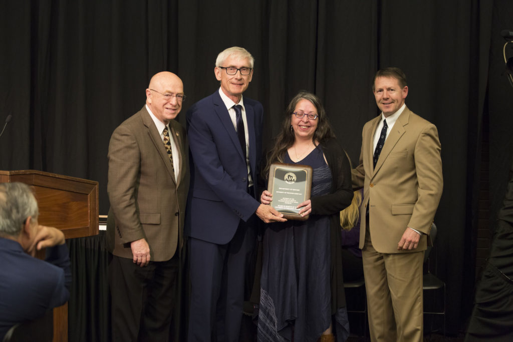 Photo of President Ray Cross, Regent Tony Evers, UW-Green Bay Department Chair Heidi Sherman, and Regent President John R. Behling