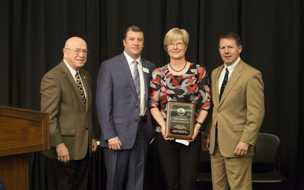 Photo of President Cross, Regent Plante, Prof. Lindseth, and Regent President Behling