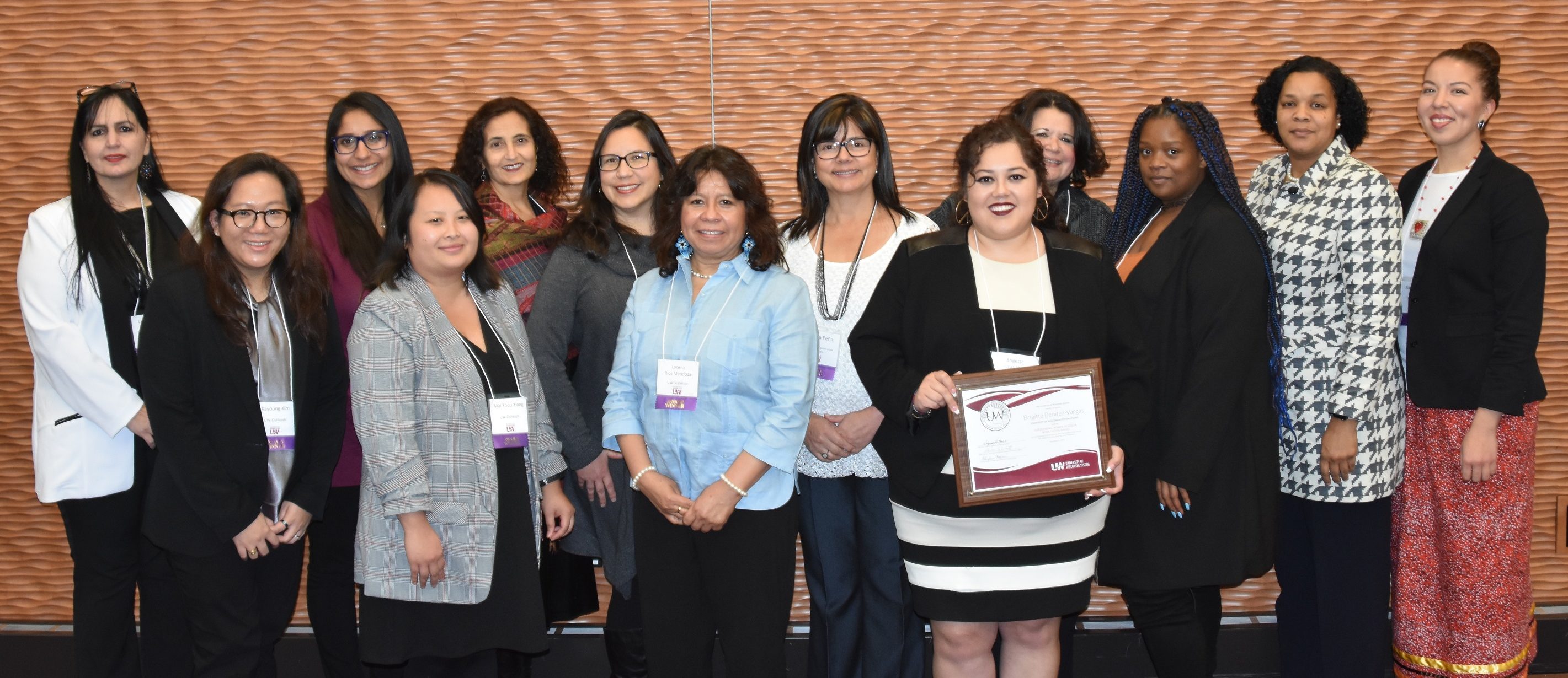 Photo of (from left) Laura Khoury, UW-Parkside; Kayoung Kim, UW-Oshkosh, UW-Fond du Lac campus; Manu Sharma, UW-River Falls; Mai Khou Xiong, UW-Oshkosh; Jan Larson, UW-Eau Claire; Graciela Engen, UW-La Crosse; Lorena Rios Mendoza, UW-Superior; María Yolanda Peña, UW-Madison Cooperative Extension; Brigitte Benitez-Vargas, UW-Stevens Point; Brenda Cárdenas, UW-Milwaukee; Otaasia Barfield, UW-Stout; Jacqueline Hunter, UW-Platteville; and Alana Dallas, UW-Green Bay Not pictured: Christy Clark-Pujara, UW-Madison; Ozalle Toms, UW-Whitewater (Photo by Ethan Schuh, UW System)