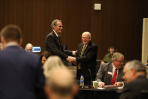Photo of Chancellor Joe Gow and UW System President Ray Cross shaking hands during the first day of the UW System Board of Regents meeting hosted by UW-La Crosse (December 6, 2018)