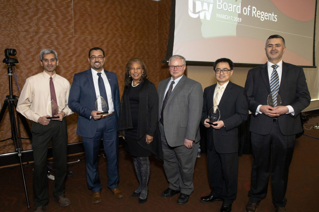Photo of 2019 Regent Scholars (from left) Gokul Gopalakrishman, Saleh Alnaeli, Regent Eve Hall, Regent Mark Tyler, Yijun Tang, and Zaid Altahat. (Photo by Craig Wild/UW-Madison)