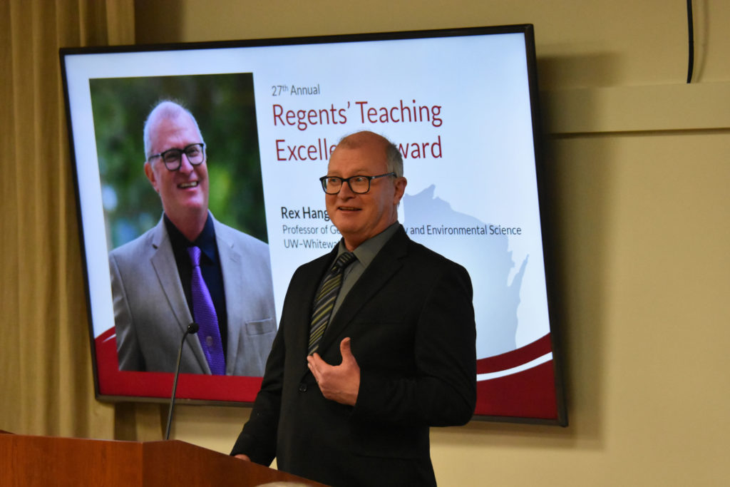 Photo of UW-Whitewater Professor Rex Hanger making acceptance remarks after receiving the 2019 Teaching Excellence Award from the UW System Board of Regents on April 5, 2019.